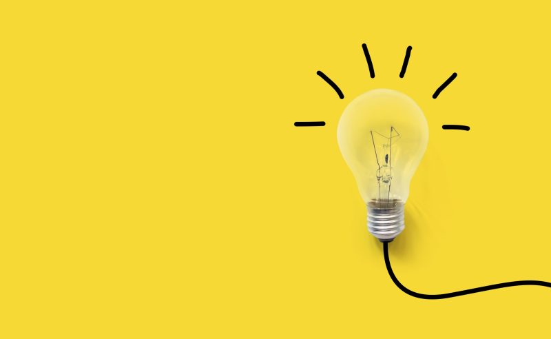 Creative thinking ideas brain innovation concept. Light bulb on yellow background